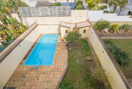 Casa com 548m², 5 quartos, 3 suítes, 4 vagas, no bairro Chácara Das Pedras em Porto Alegre